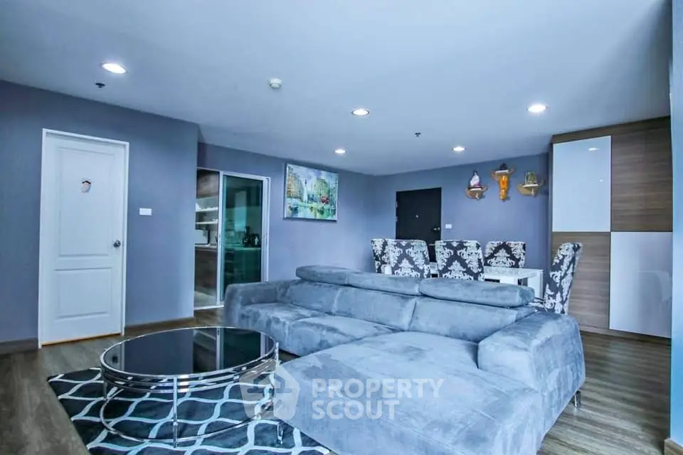 Spacious modern living room with plush gray sofa and stylish decor