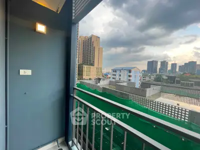 Stunning cityscape view from a modern balcony in a high-rise apartment.