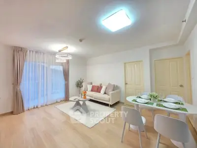 Spacious modern living room with elegant decor and dining area