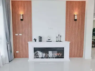 Elegant living room with modern fireplace and stylish wall sconces, perfect for cozy evenings.