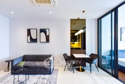 Modern living room with sleek furniture and stylish decor in a contemporary apartment.