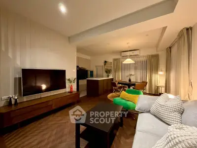 Modern living room with stylish decor and open kitchen layout