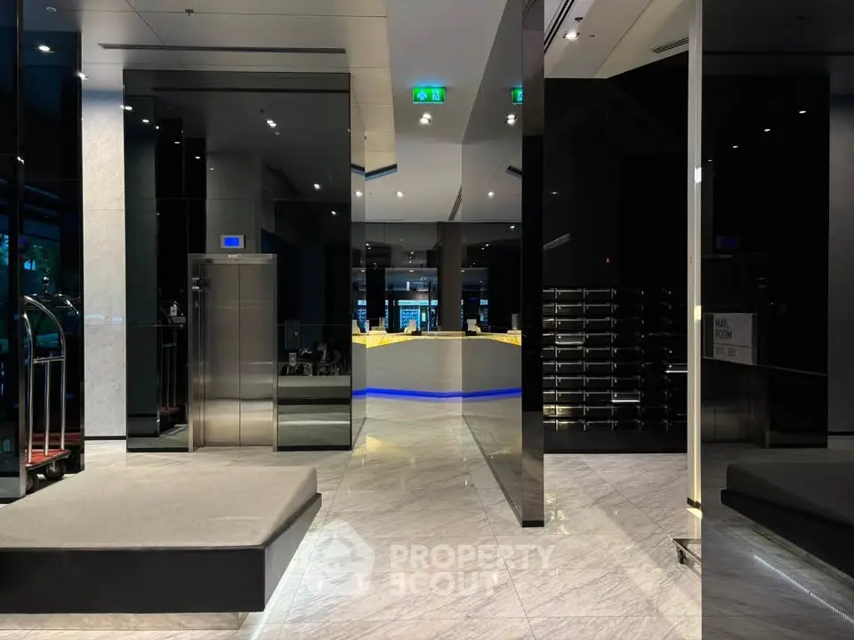 Luxurious modern building entrance with sleek elevators and stylish marble flooring.