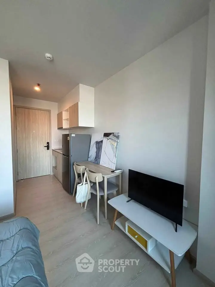 Modern compact living space with kitchenette and stylish decor