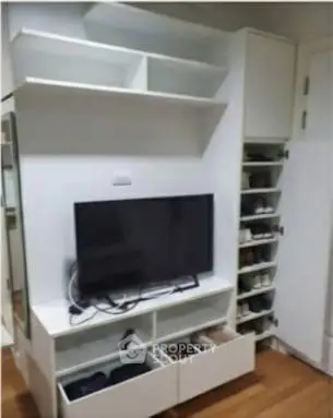 Modern living room with sleek TV unit and ample storage space