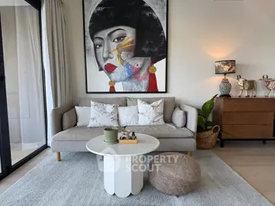 Stylish living room with modern art, cozy sofa, and elegant decor in a bright, inviting space.