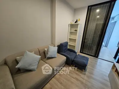 Cozy living room with modern sofa and sleek wooden flooring