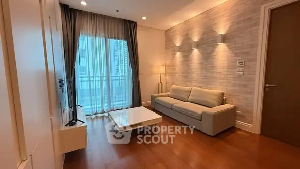 Modern living room with elegant lighting and cozy sofa in a stylish apartment.