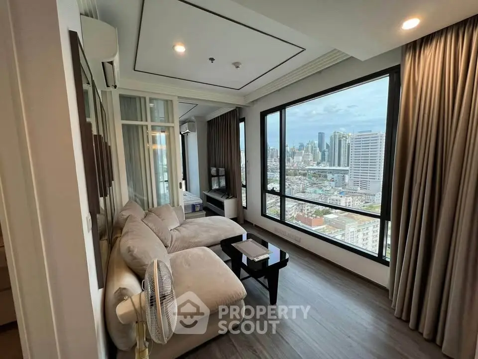Luxurious living room with panoramic city view and modern furnishings.