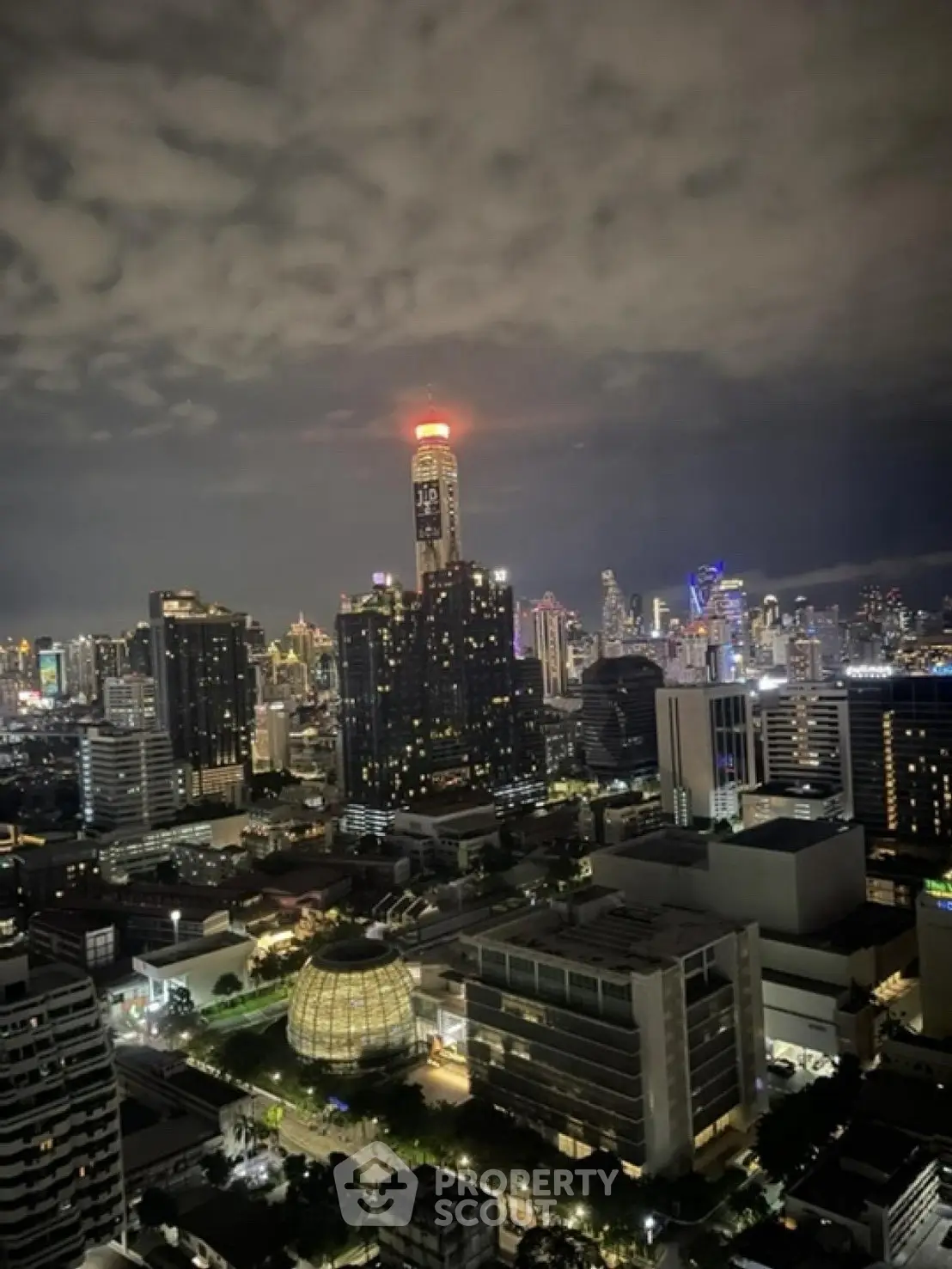 Stunning nighttime cityscape view with illuminated skyscrapers and vibrant skyline.