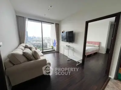 Modern living room with city view and adjacent bedroom