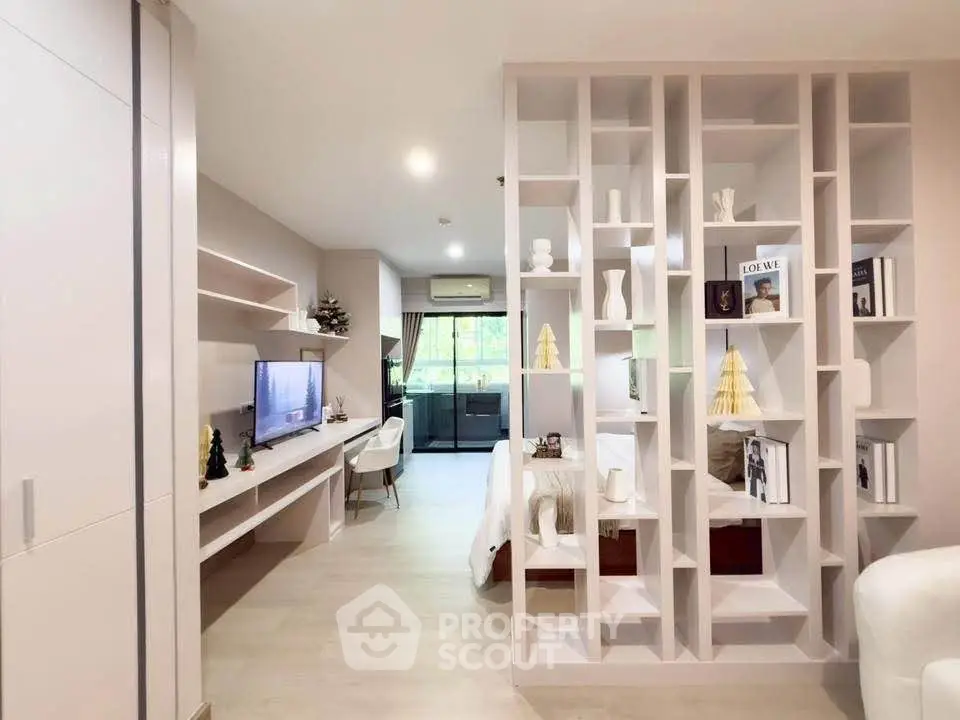 Modern open-plan living room with stylish partition and natural light