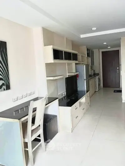 Modern apartment interior with sleek furniture and integrated appliances