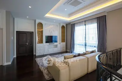 Luxurious living room with elegant decor and large windows for natural light.