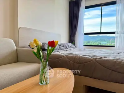 Cozy bedroom with scenic window view and elegant decor