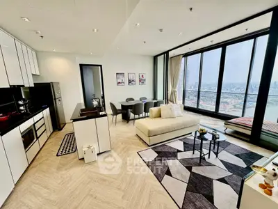 Spacious modern living room with panoramic city view and open kitchen layout