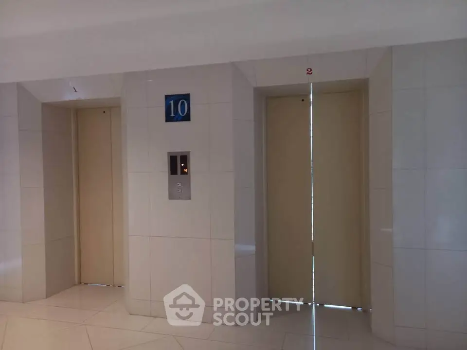 Modern building elevator lobby on the 10th floor with sleek design.