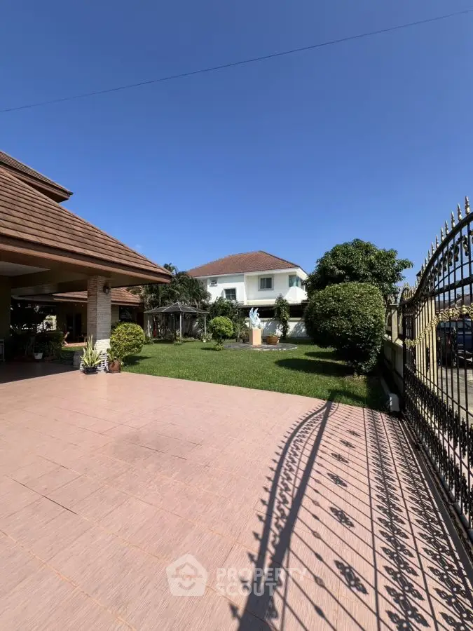 Charming suburban home with spacious garden and elegant entrance