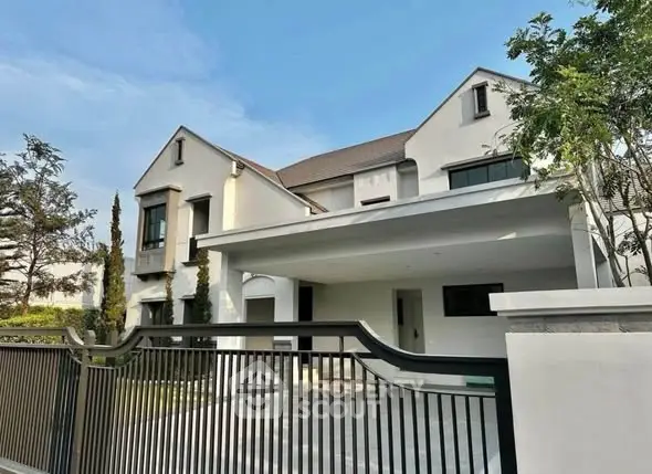 Luxurious modern house with spacious driveway and elegant architecture in a serene neighborhood.