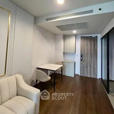 Modern living room with elegant furniture and wooden flooring