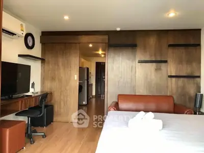 Modern studio apartment with wooden accents and cozy furnishings