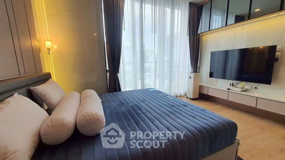 Luxurious modern bedroom with large window and stylish decor