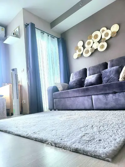 Stylish living room with plush sofa and modern decor in bright apartment
