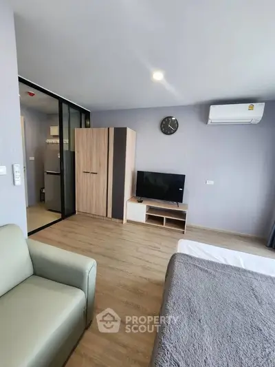 Modern studio apartment with sleek furnishings and air conditioning
