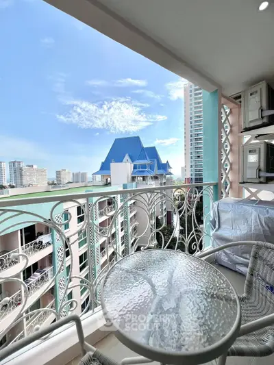 Charming balcony with elegant railing and city view, perfect for relaxation.