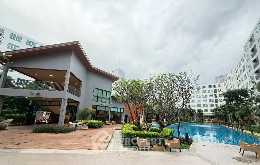 Modern residential complex with pool and lush greenery, perfect for luxury living.