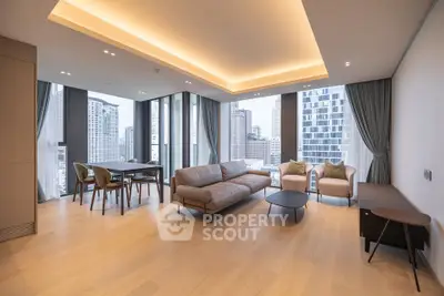 Luxurious modern living room with panoramic city views and elegant furnishings.