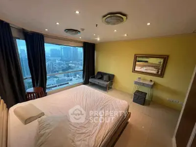 Spacious bedroom with city view and modern furnishings in high-rise apartment