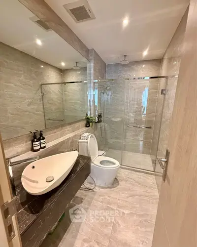 Luxurious modern bathroom with sleek design and glass shower enclosure