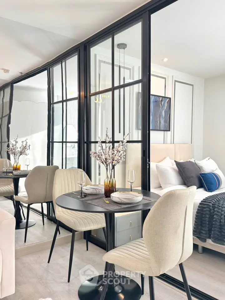 Modern studio apartment with elegant dining area and cozy bedroom