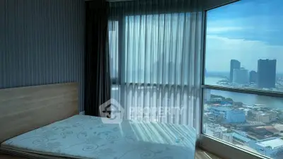 Stunning bedroom with panoramic city view and natural light