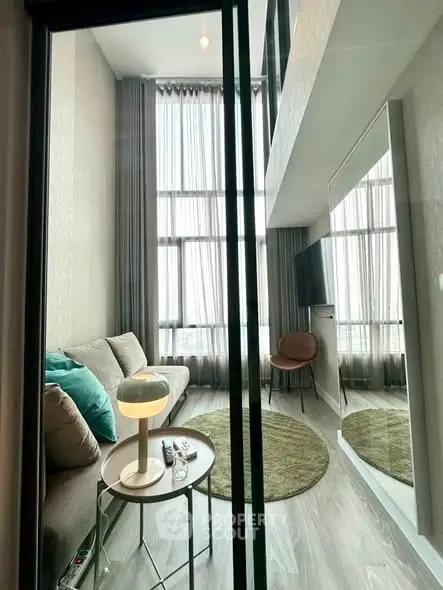 Modern living room with high ceilings and stylish decor