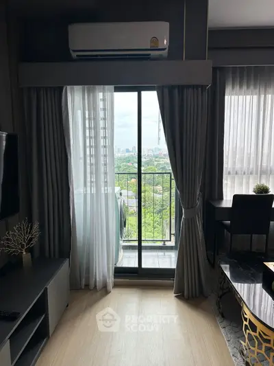 Modern living room with balcony and city view, featuring elegant decor and natural light.