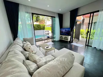 Spacious living room with pool view and modern decor