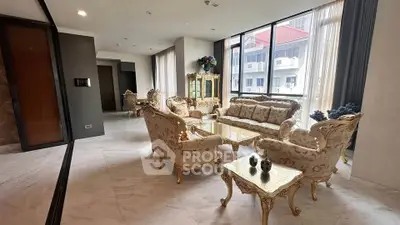 Luxurious living room with elegant furniture and large windows offering city views.
