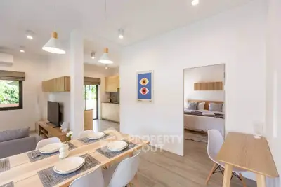 Modern open-plan living and dining area with stylish decor and natural light