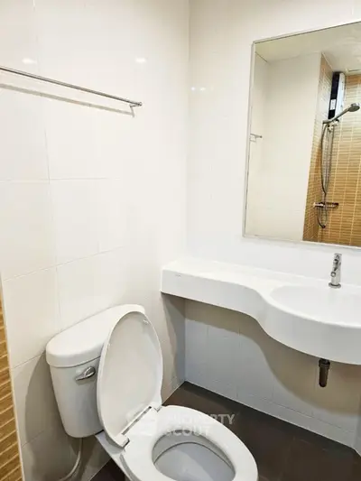 Modern bathroom with sleek white fixtures and contemporary design