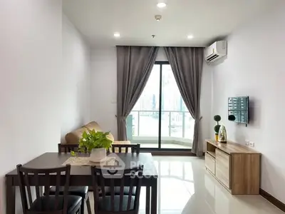 Modern living room with balcony view and stylish furniture