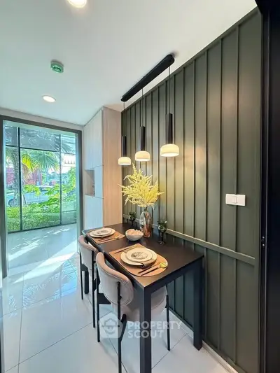 Modern dining area with elegant decor and large window view