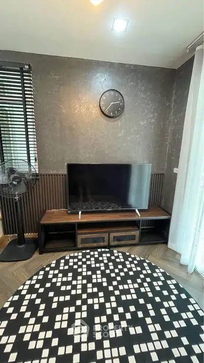 Modern living room with stylish decor and sleek TV setup