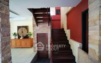 Stylish interior with wooden staircase and modern decor