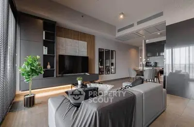 Modern living room with sleek design and open kitchen layout