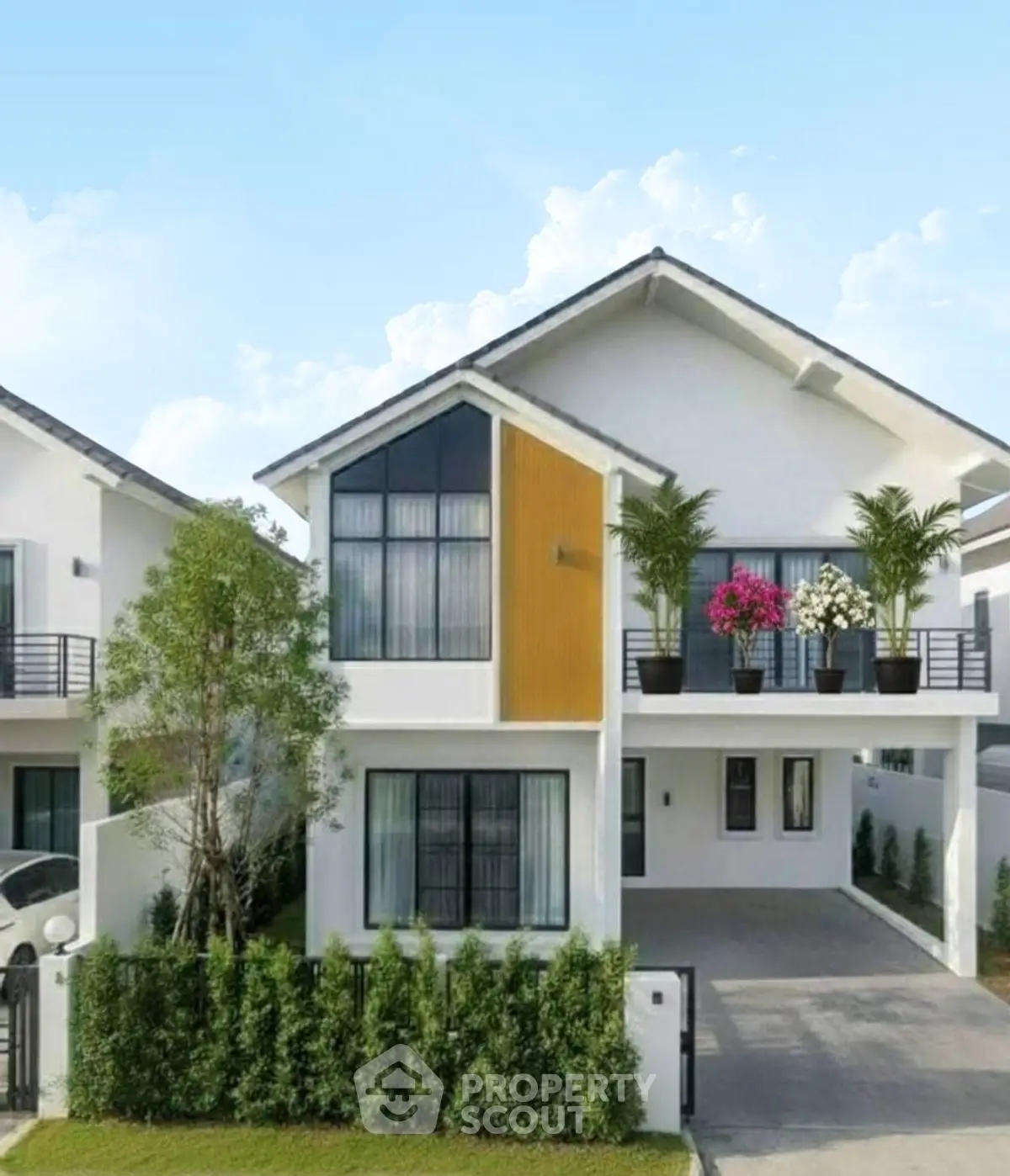 Modern two-story house with landscaped garden and driveway