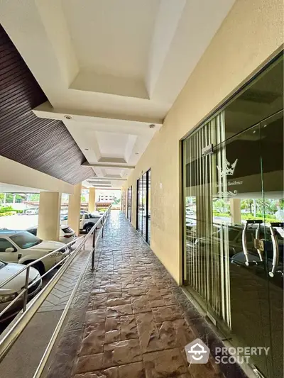 Elegant building entrance with modern design and spacious walkway