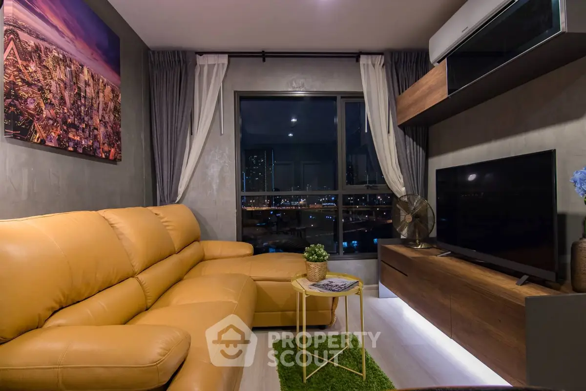 Modern living room with cozy leather sofa and city view window