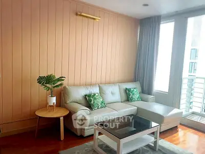 Stylish living room with cozy sofa and natural light, perfect for relaxation.